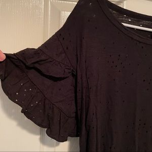 Black short sleeve ruffle shirt with smell eyelet design. Like new. Medium.